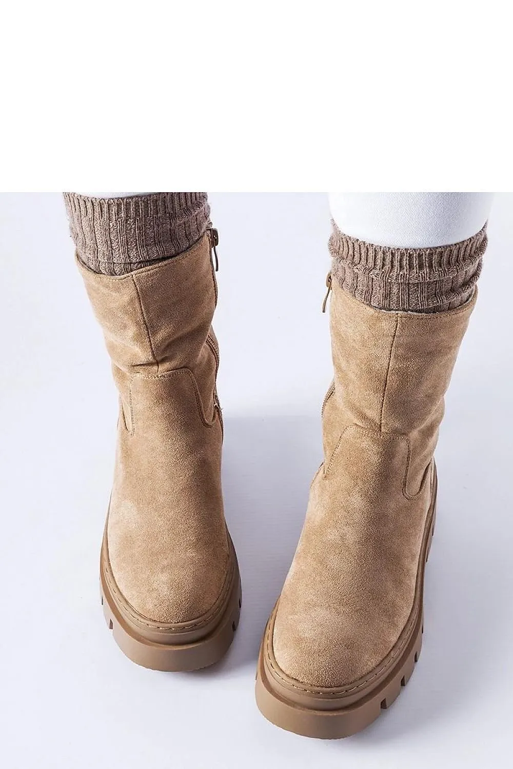 Brown insulated boots with a massive platform