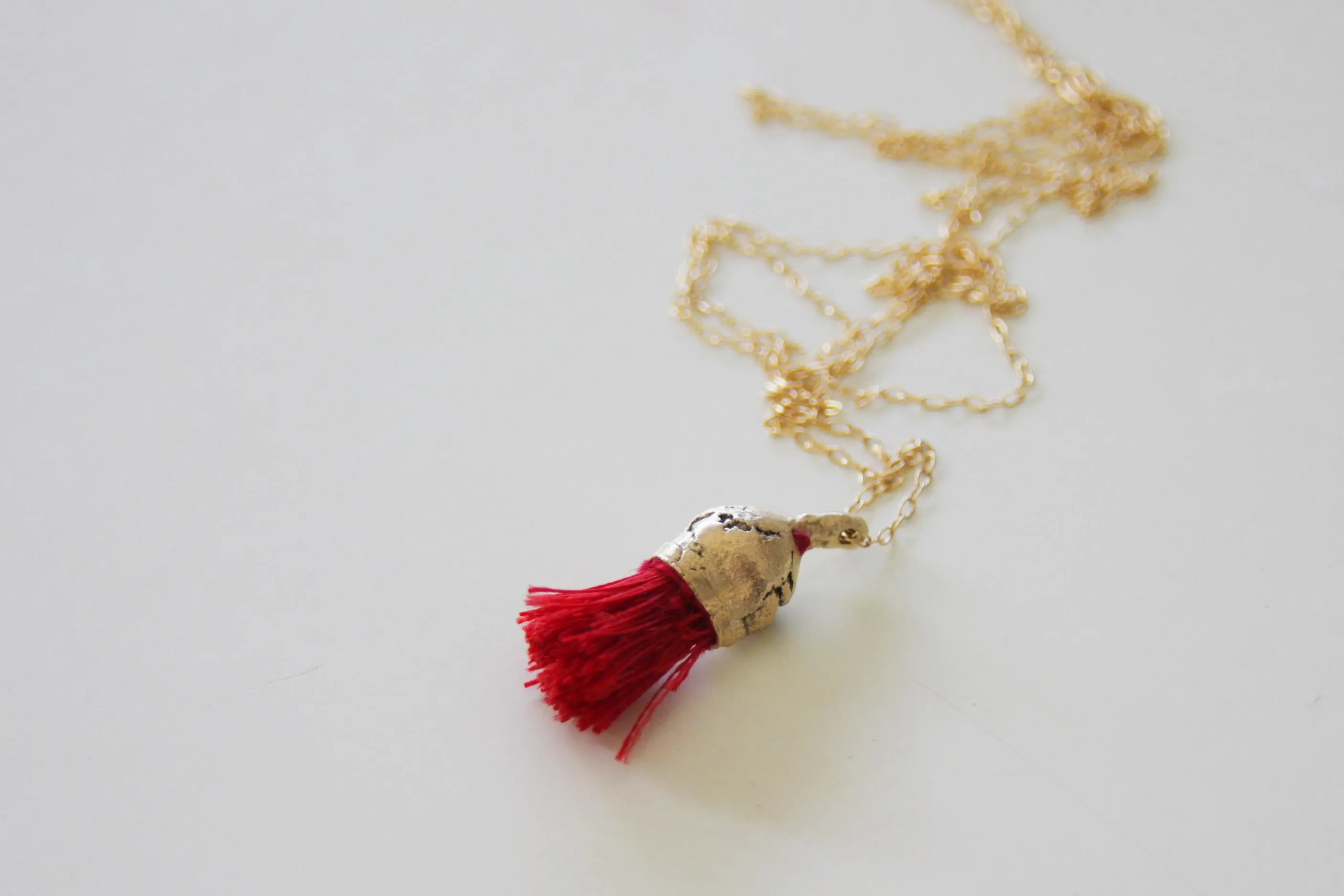 Red Tassel Organic Gold And Cotton Pendant
