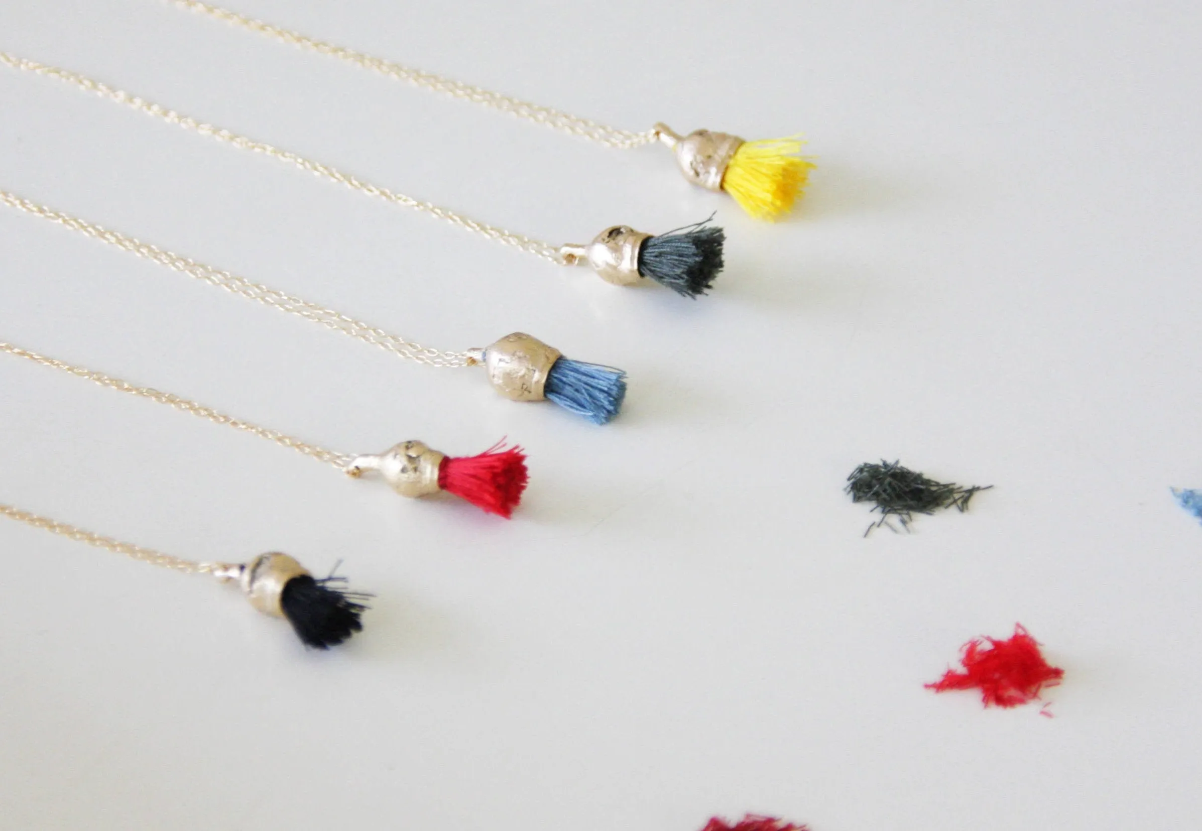 Red Tassel Organic Gold And Cotton Pendant